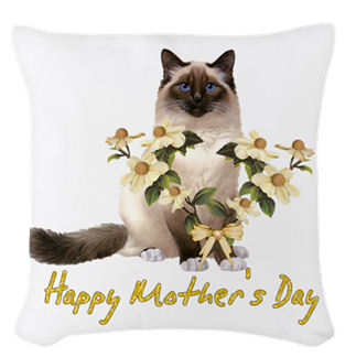 Lovely white, cream, and brown cat with flowers to match, a pretty ribbon, and the words Happy Mother's Day.